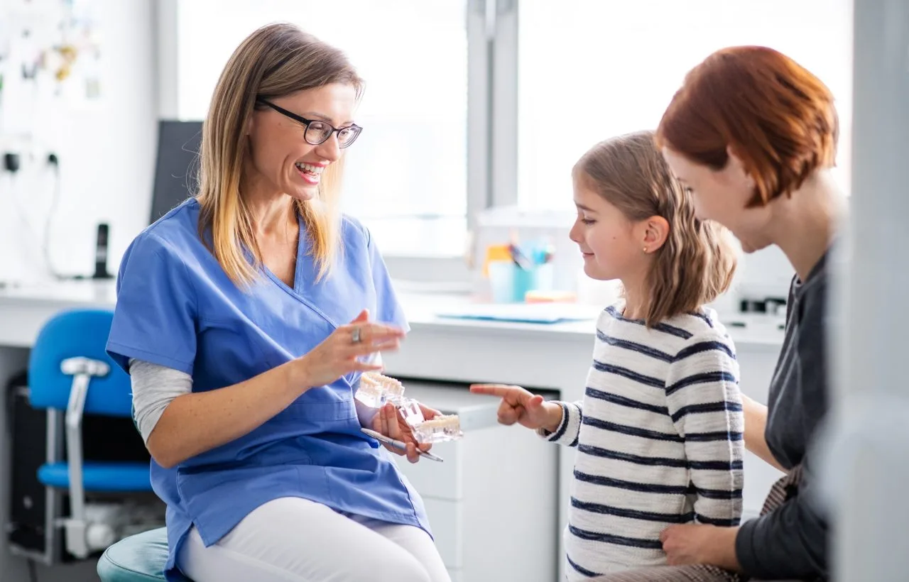 a-small-girl-mother-and-dentist-in-surgery-dental-checkup Smog Check