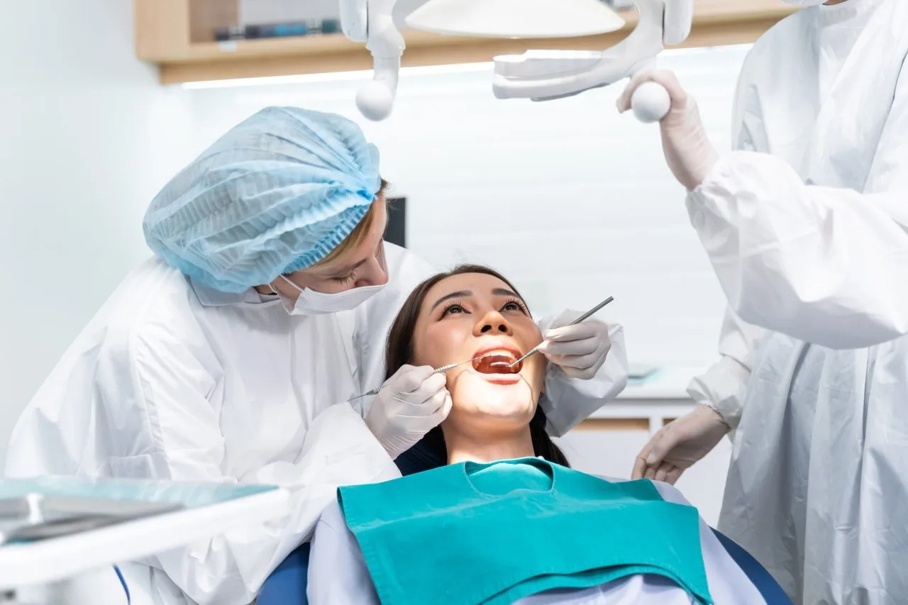 caucasian-dentist-examine-tooth-for-young-girl-at-dental-health-clinic- Smog Check
