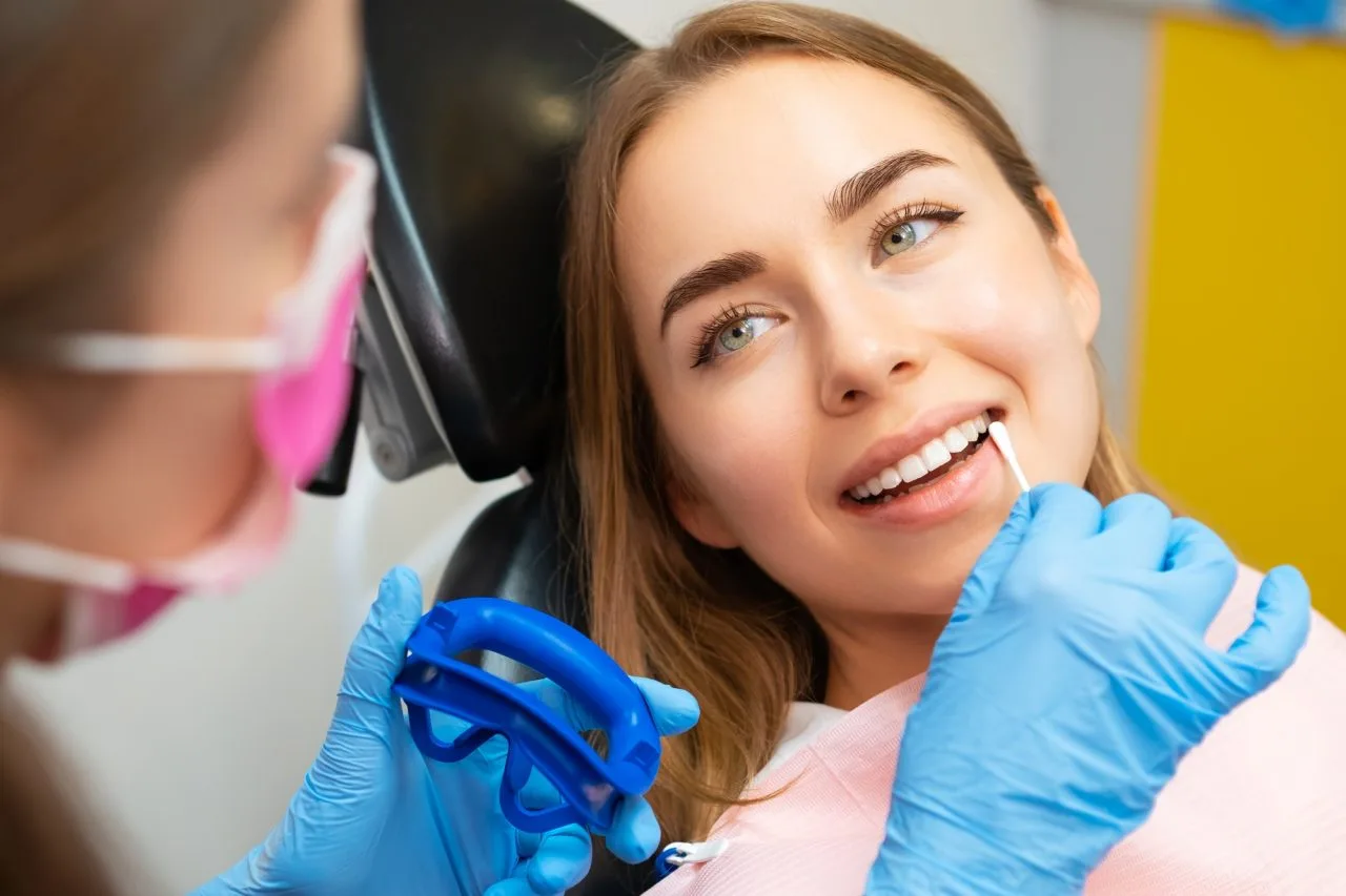 dentist-applies-plaque-detector-on-front-teeth-in-clinic Smog Check