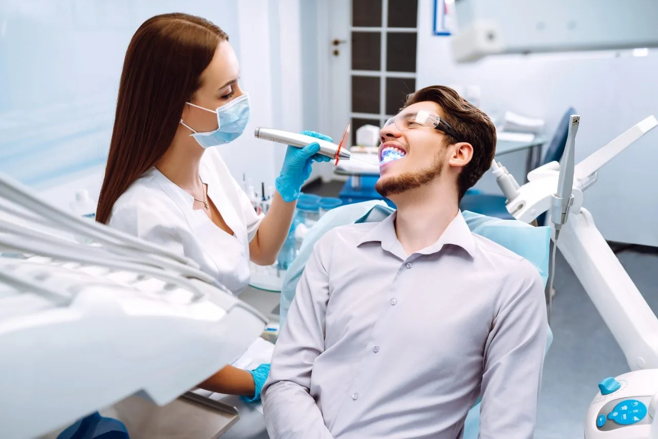 young-man-at-the-dentist-s-chair-during-a-dental-procedure-overview-of-dental-caries-prevention- Smog Check